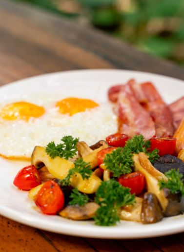 American breakfast with fried eggs and bacon